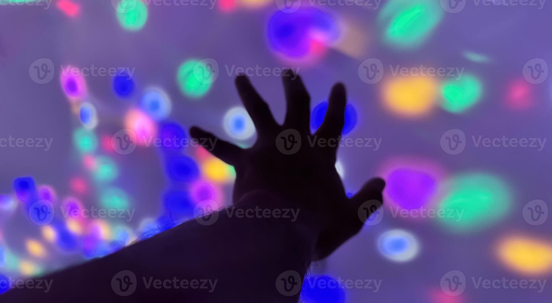 Hand gesture silhouette on a colorful background reaching out, saying hello, and show number represent photo