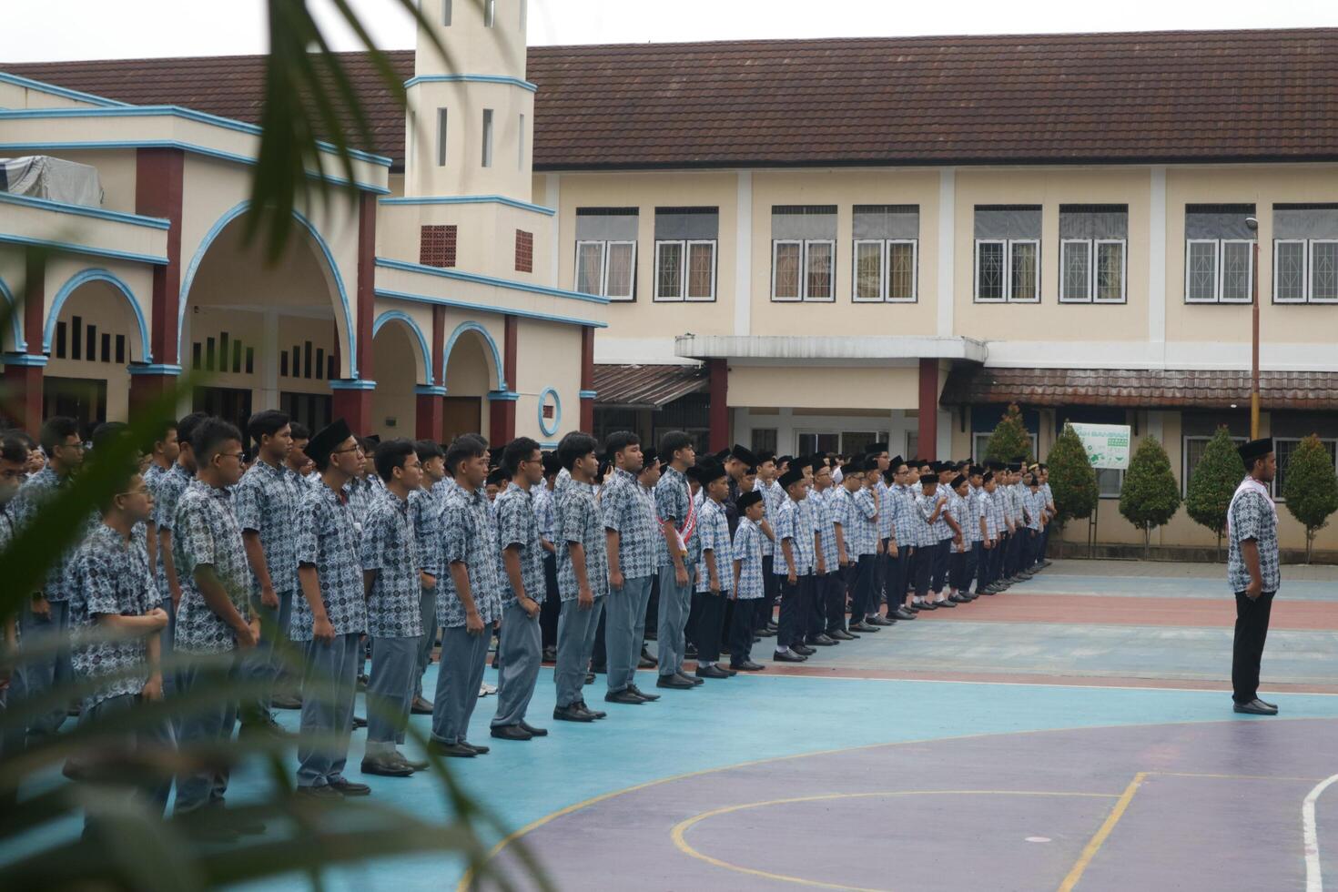 Subang, Indonesia - May 2024, Middle school, high school students and teachers taking part in a ceremony to commemorate National Education Day on the school field photo