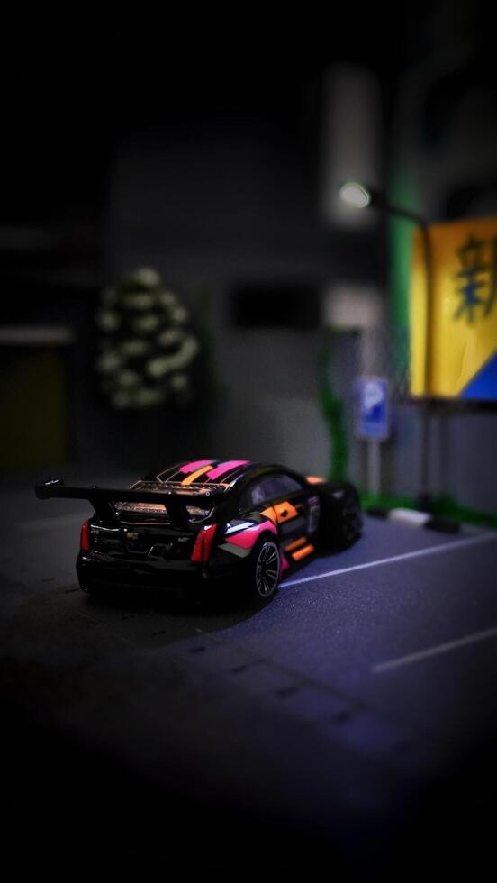 Subang, Indonesia - June 06th 2024 - Image of a scale Hotwheels hobby car model parked in a diorama. The art of die casting cars in parking dioramas. photo
