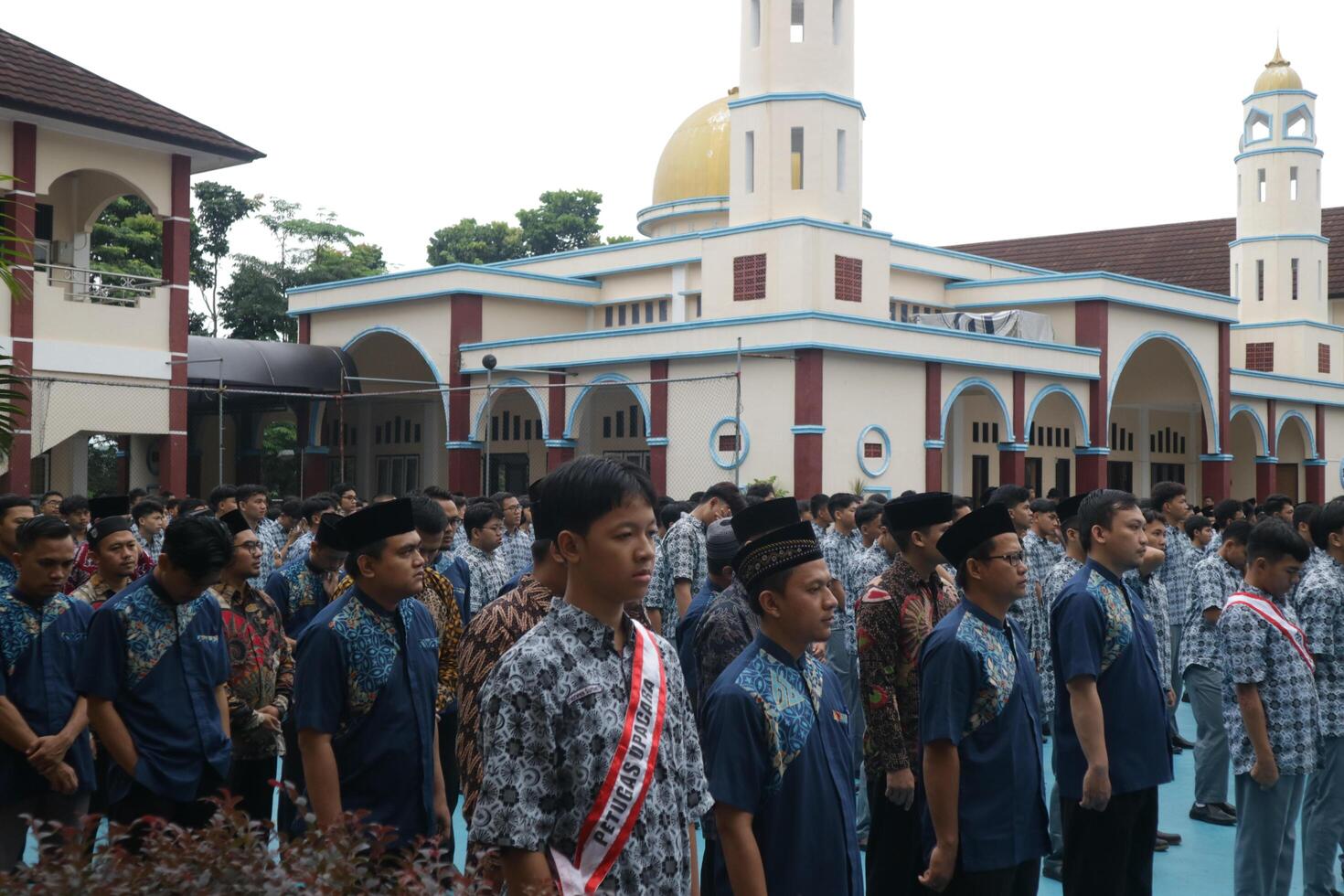 Subang, Indonesia - May 2024, Middle school, high school students and teachers taking part in a ceremony to commemorate National Education Day on the school field photo