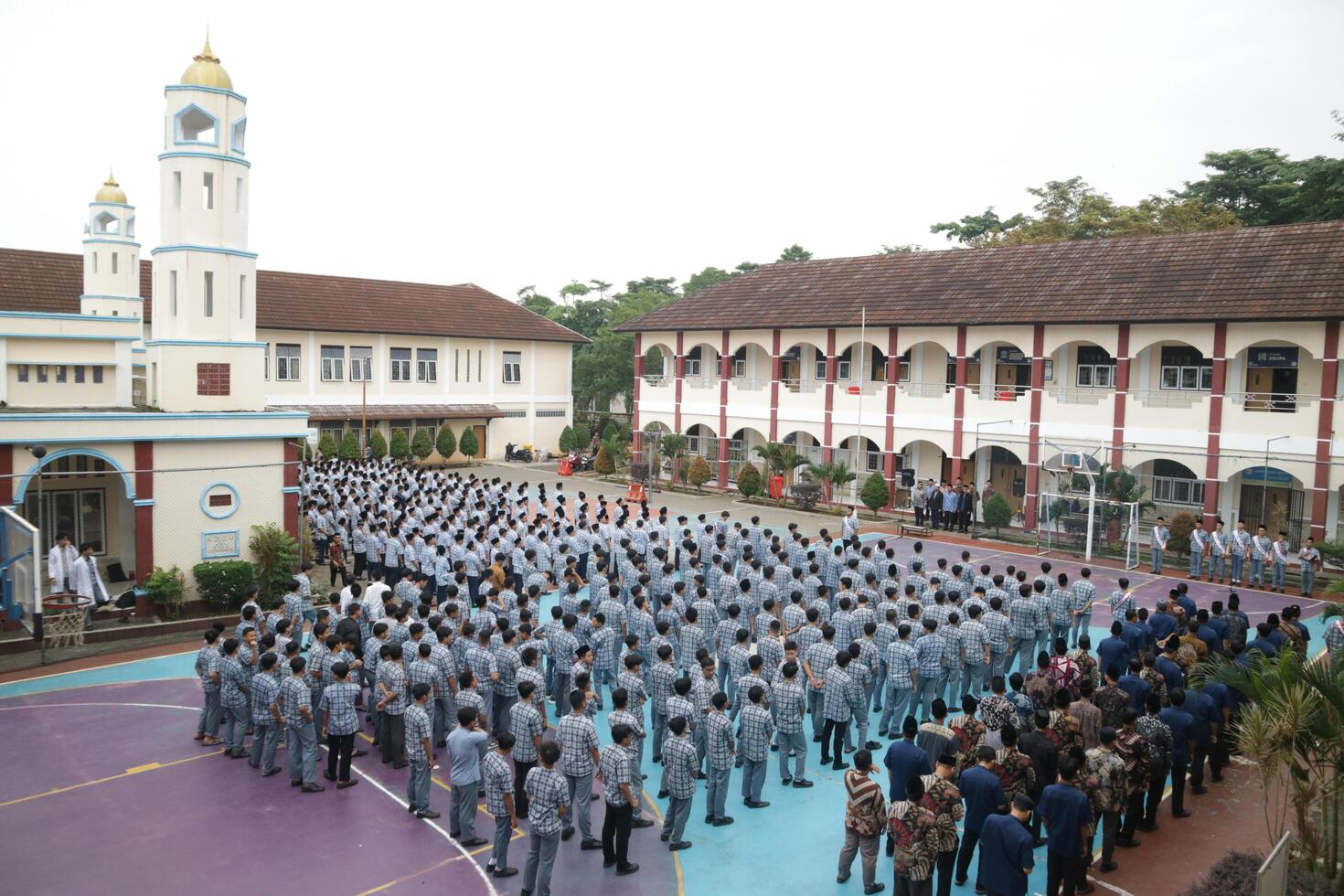 Subang, Indonesia - May 2024, Middle school, high school students and teachers taking part in a ceremony to commemorate National Education Day on the school field photo