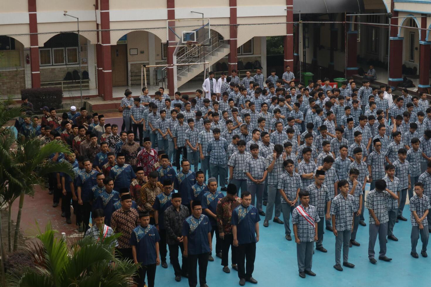 Subang, Indonesia - May 2024, Middle school, high school students and teachers taking part in a ceremony to commemorate National Education Day on the school field photo