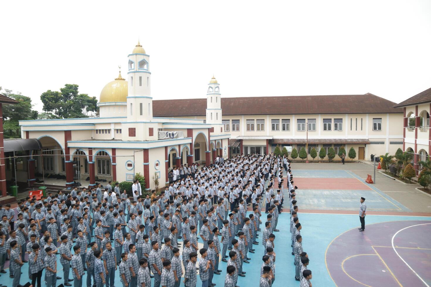 Subang, Indonesia - May 2024, Middle school, high school students and teachers taking part in a ceremony to commemorate National Education Day on the school field photo