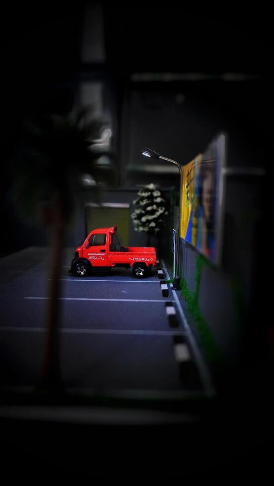 Subang, Indonesia - June 06th 2024 - Image of a scale Hotwheels hobby car model parked in a diorama. The art of die casting cars in parking dioramas. photo