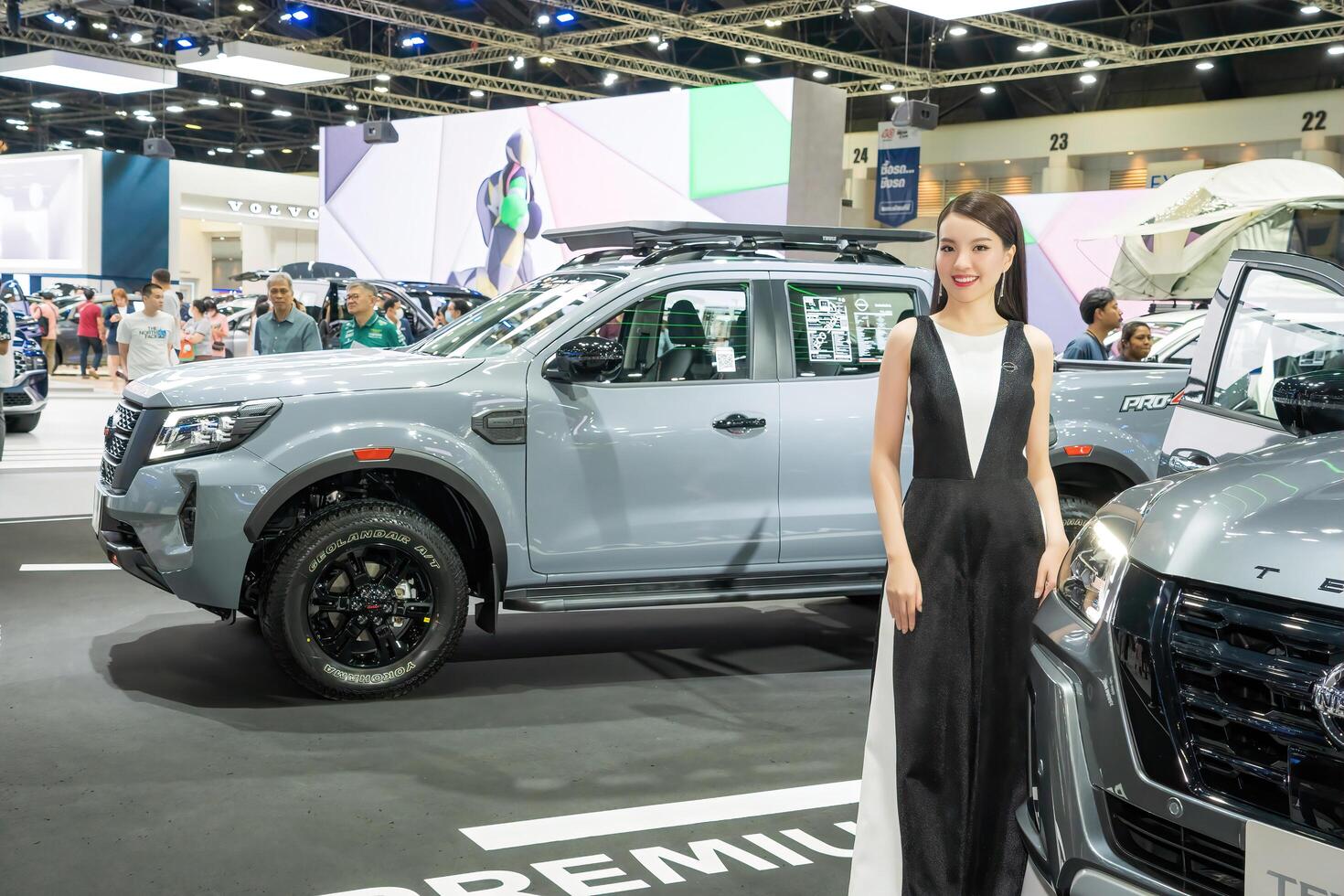 Nonthaburi, Thailand - DEC 2, 2020 - Unidentified model poses with a car at The 37th Motor Expo Thailand 2020 at IMPACT Arena, Muang Thong Thani, Nonthaburi, Thailand. photo