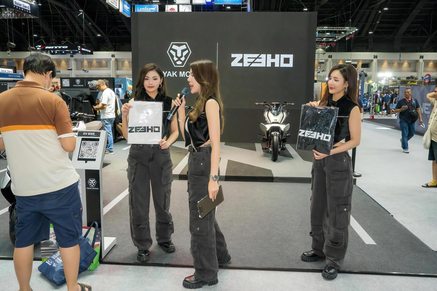 Nonthaburi, Thailand - DEC 2, 2020 - Unidentified model poses with a car at The 37th Motor Expo Thailand 2020 at IMPACT Arena, Muang Thong Thani, Nonthaburi, Thailand. photo