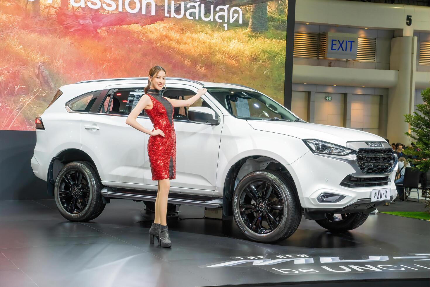Nonthaburi, Thailand - DEC 2, 2020 - Unidentified model poses with a car at The 37th Motor Expo Thailand 2020 at IMPACT Arena, Muang Thong Thani, Nonthaburi, Thailand. photo