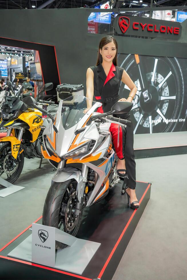 Nonthaburi, Thailand - DEC 2, 2020 - Unidentified model poses with a car at The 37th Motor Expo Thailand 2020 at IMPACT Arena, Muang Thong Thani, Nonthaburi, Thailand. photo