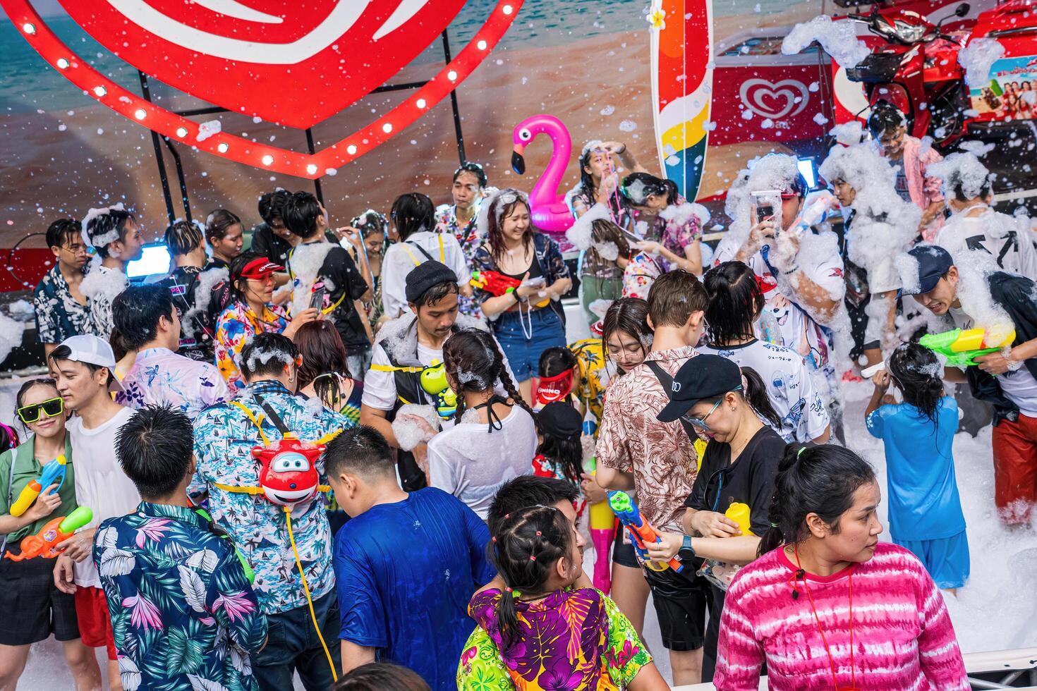 Siam Square, Bangkok, Thailand - APR 13, 2024 Songkran Festival, The short action of people joins celebrations of the Thai New Year or Songkran in Siam Square Bangkok, Thailand. photo