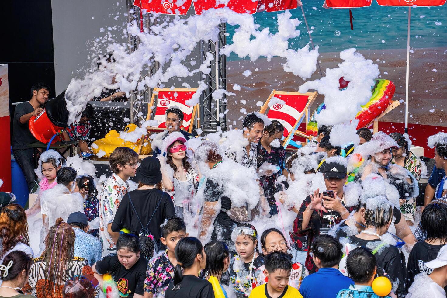 Siam Square, Bangkok, Thailand - APR 13, 2024 Songkran Festival, The short action of people joins celebrations of the Thai New Year or Songkran in Siam Square Bangkok, Thailand. photo
