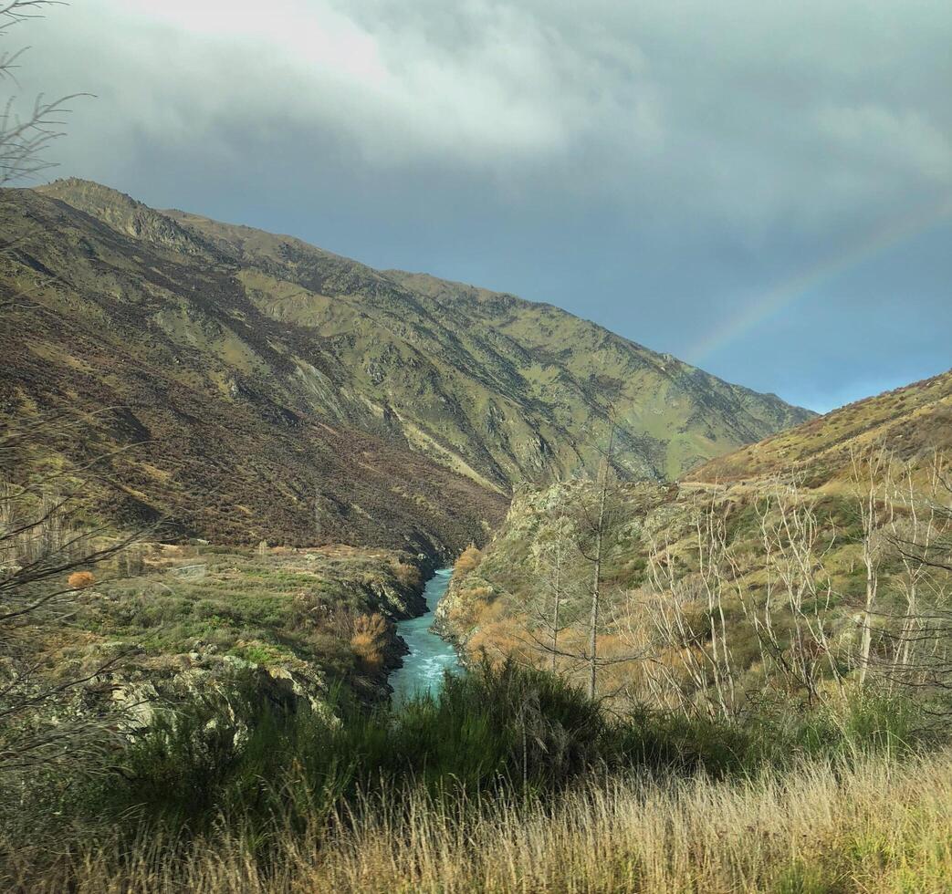 Rainbow between the mountain over the waterfall photo
