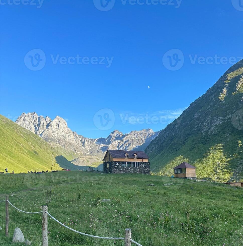 The house on the hill mountain background. photo