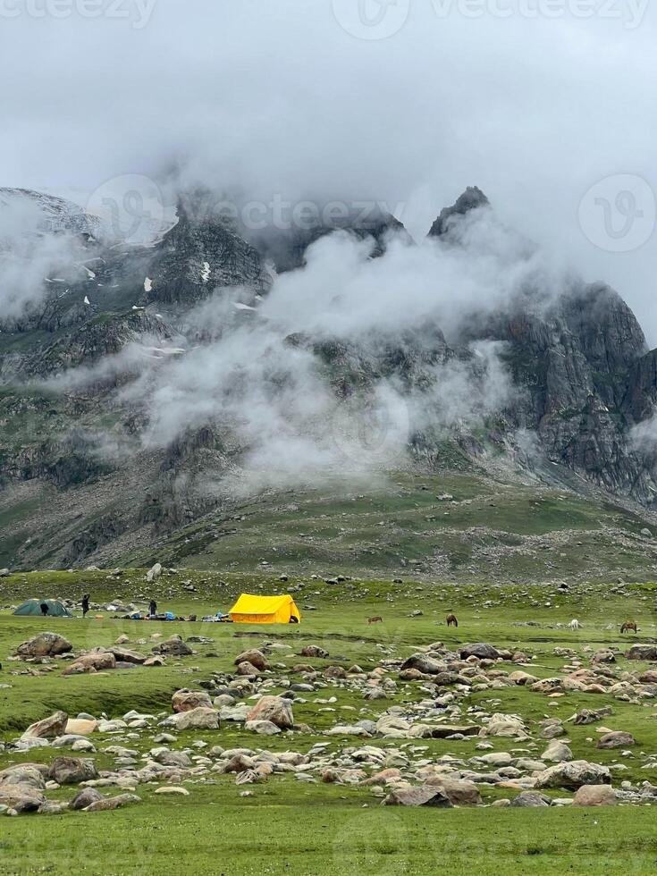 Camping tent on the peak of the Himalayas mountain and cloud photo