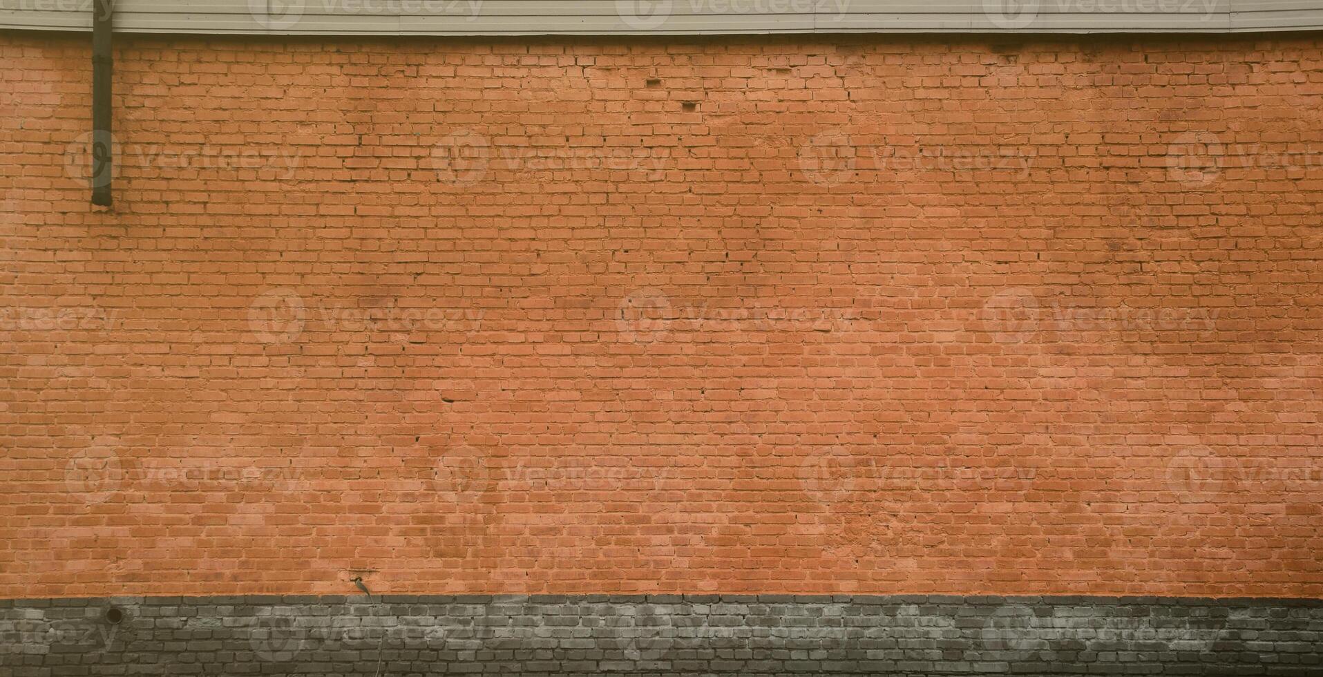 The texture of the brick wall of many rows of bricks painted in brown color photo