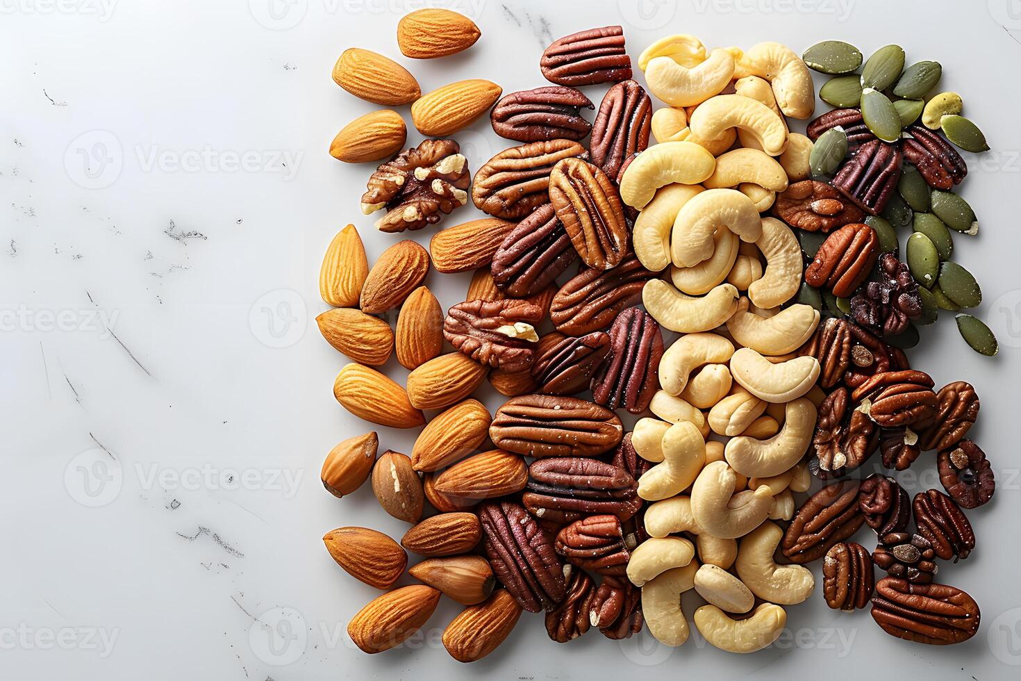 Assorted nuts and seeds displayed on a white surface photo