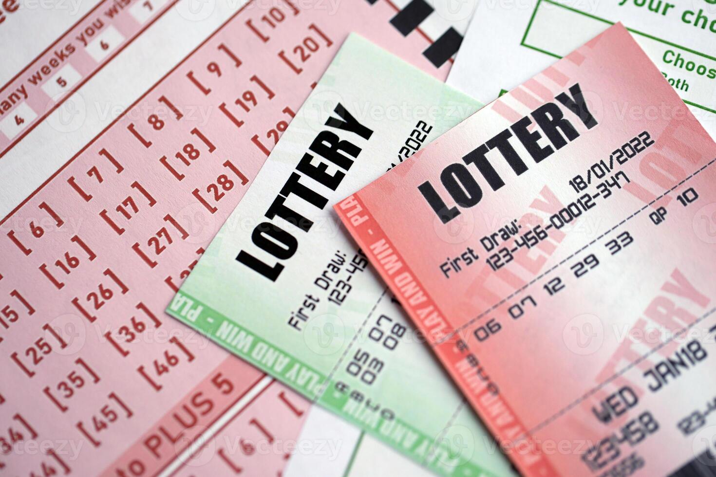 Green and red lottery tickets on blank bills with numbers for playing lottery photo