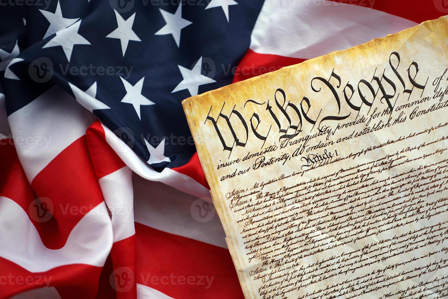 Preamble to the Constitution of the United States and American Flag close up photo