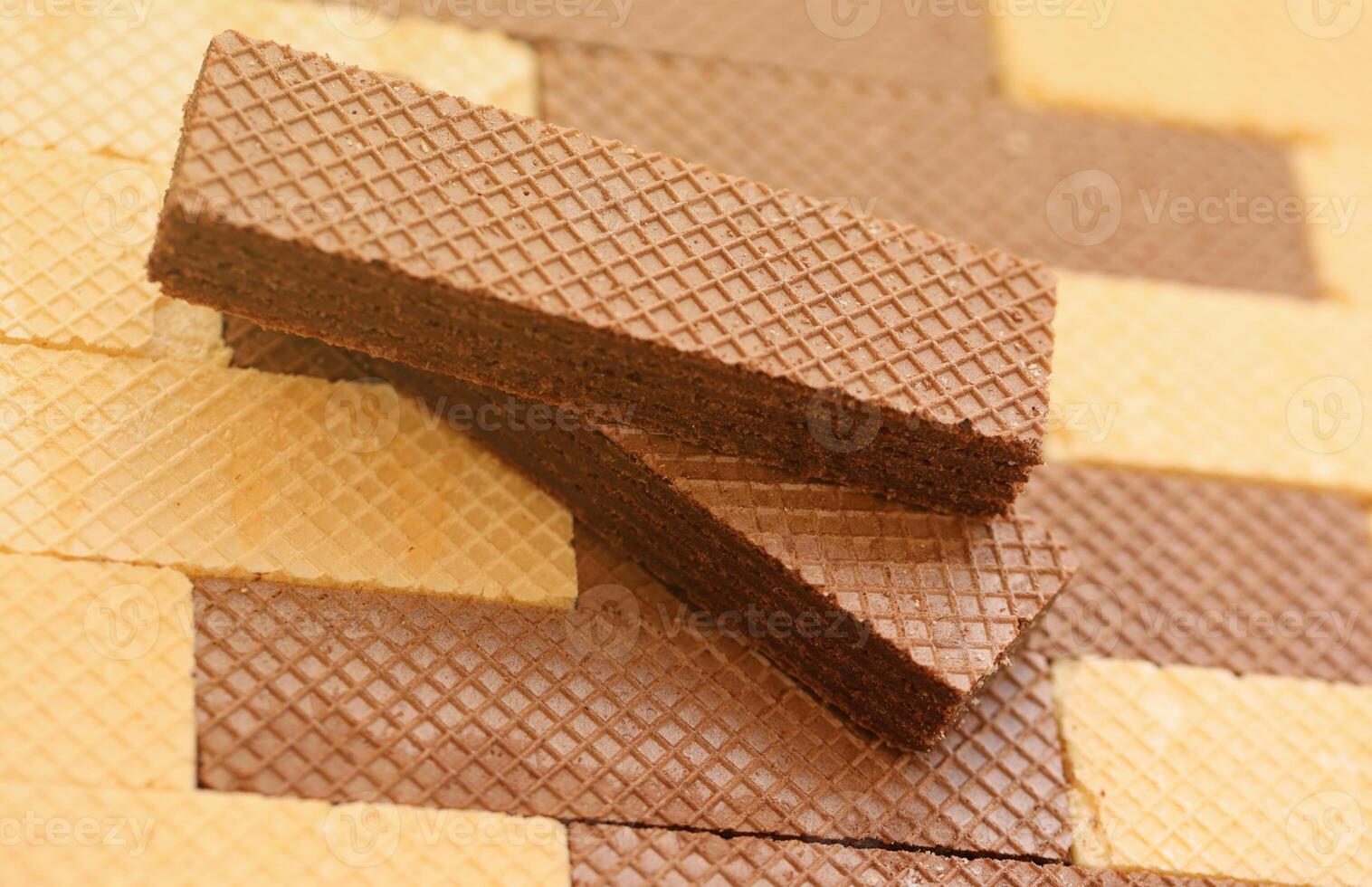 Stacked delicious chocolate wafers in large amount. Two different flavours of classic waffles photo