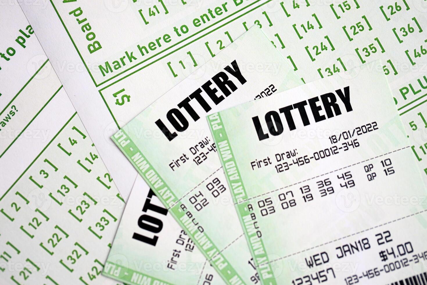 Green lottery tickets and blank bills with numbers for playing lottery photo