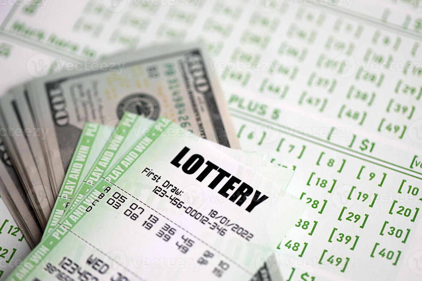 Green lottery tickets and US money bills on blank with numbers for playing lottery photo