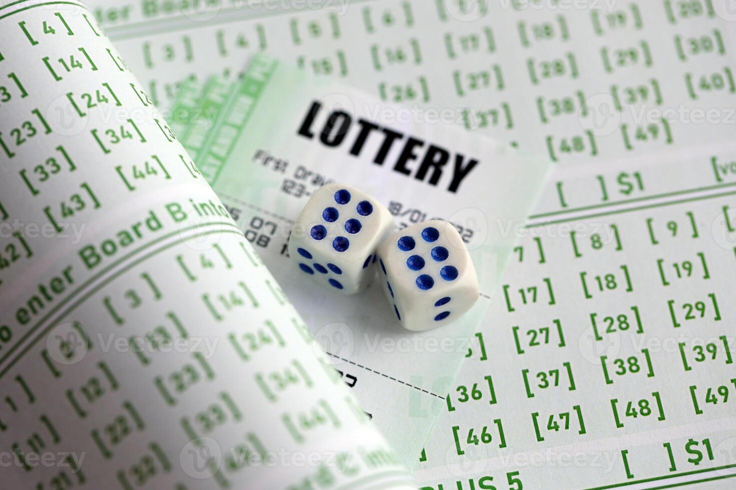 Lottery tickets and dice on blank bills with numbers for playing lottery photo