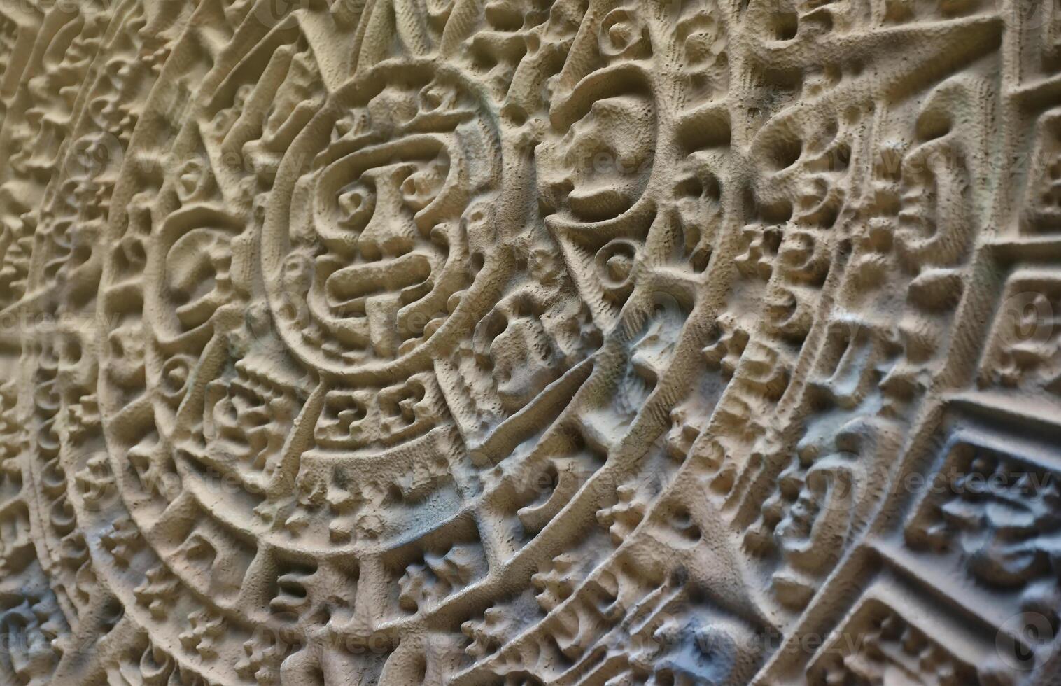 Ancient Mayan Calendar or Aztec calendar with rough relief surface photo