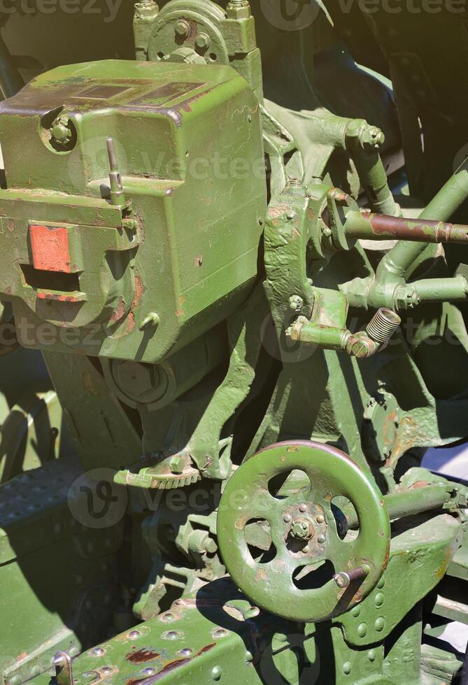 A close-up mechanism of a portable weapon of the Soviet Union of World War II, painted in a dark green color photo