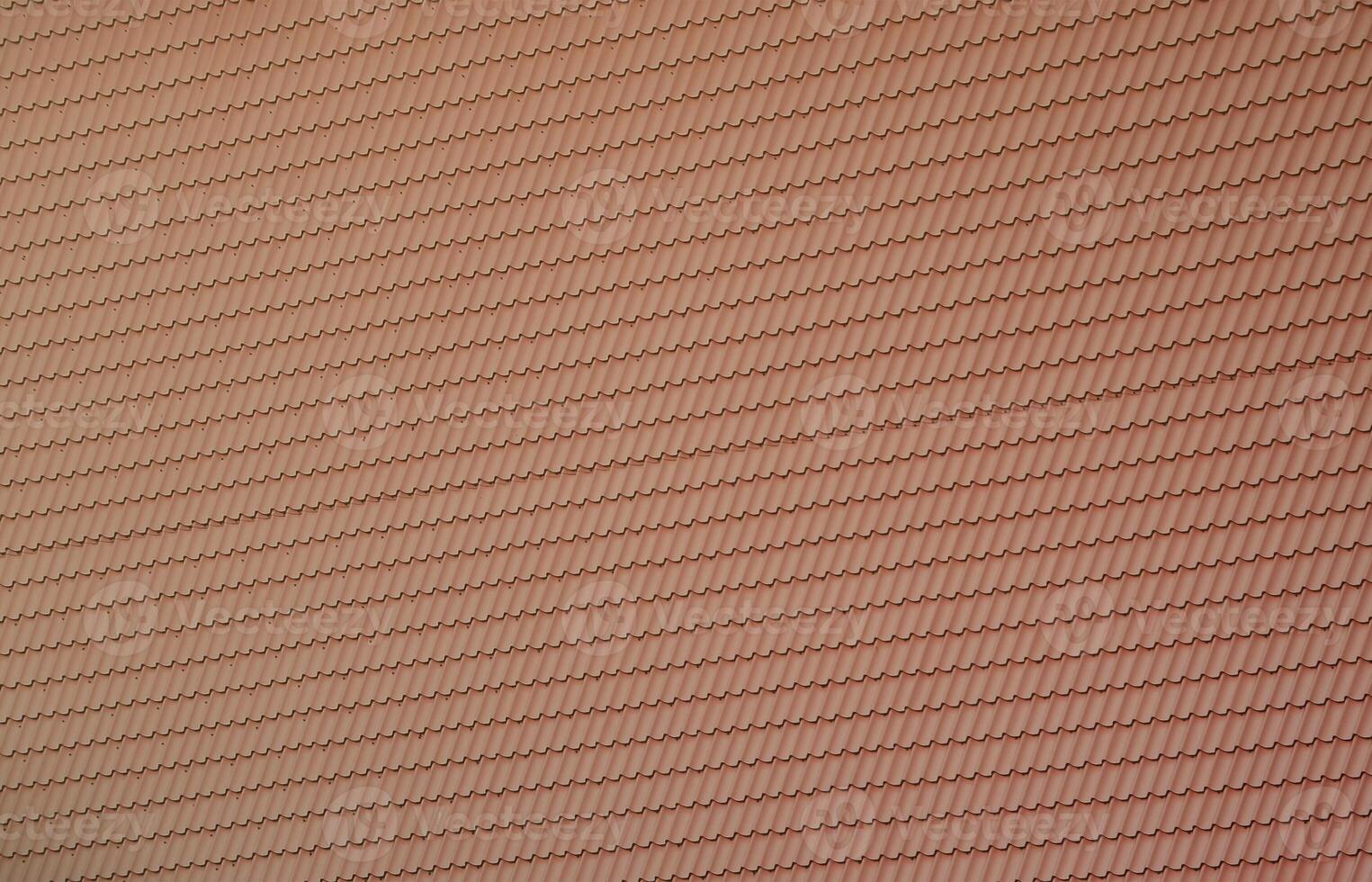 The texture of the roof of painted metal. Close-up detailed view of roof covering for pitched roof. High quality roofing photo