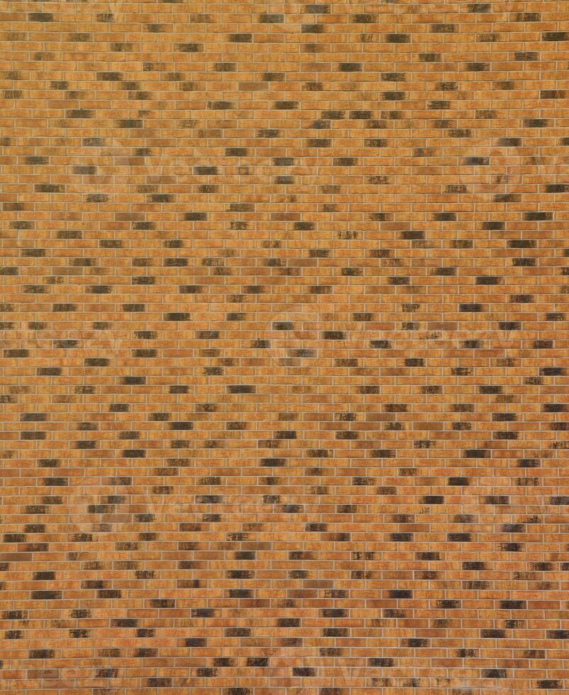 Dark brick wall pattern with chaotic masonry order. Background texture or resource for 3d texturing. Many bricks in big modern stone wall photo