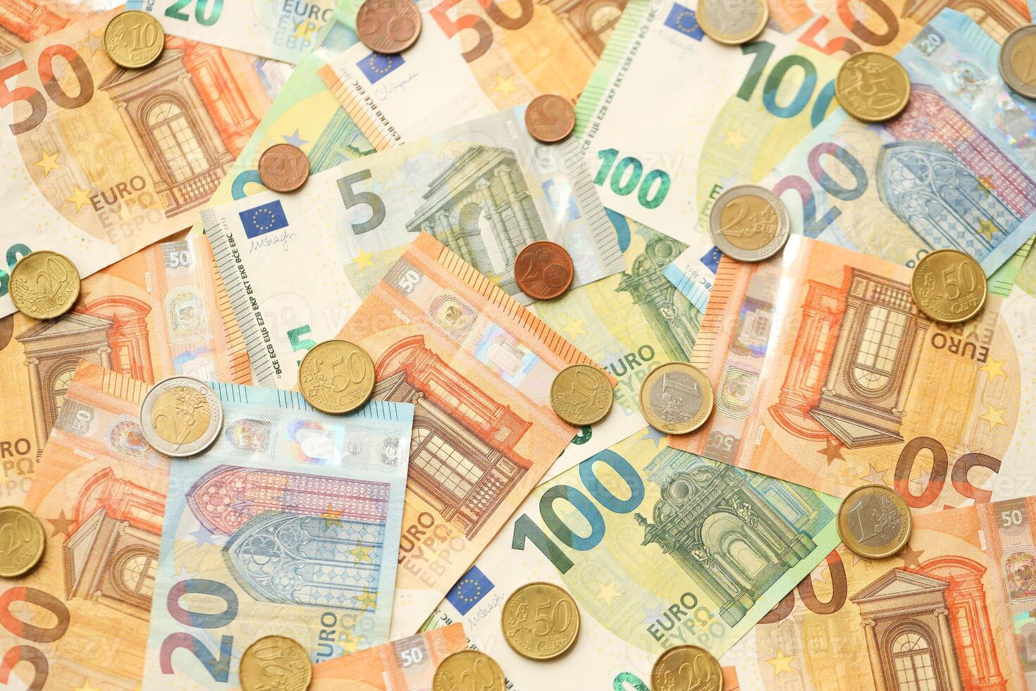 Many European euro money bills and coins. Lot of banknotes of European union currency photo