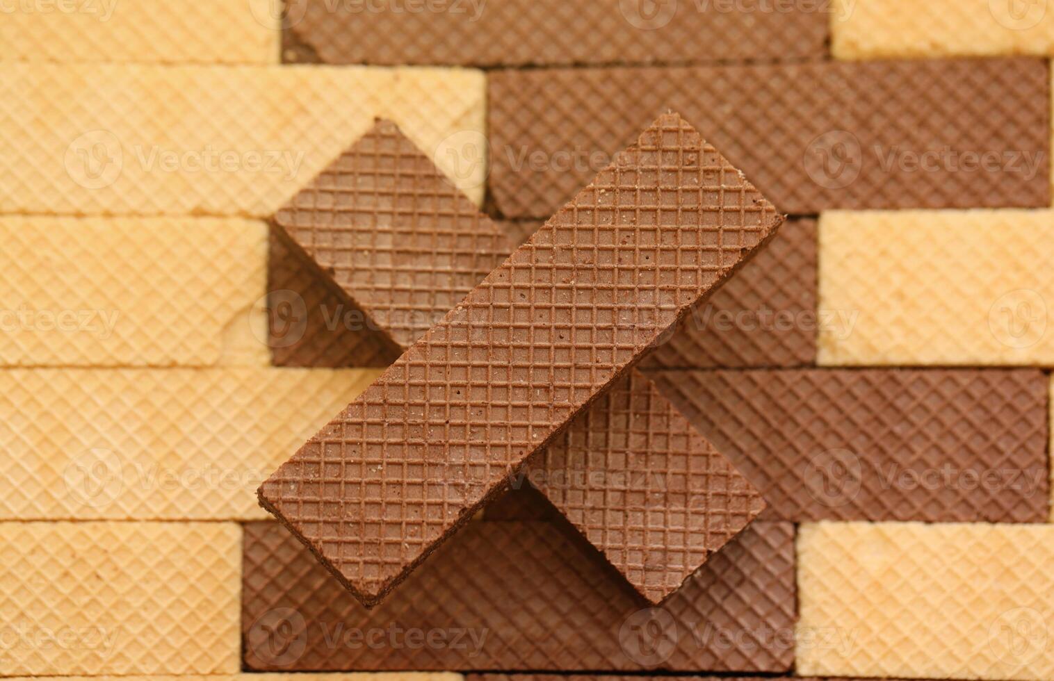 Stacked delicious chocolate wafers in large amount. Two different flavours of classic waffles photo