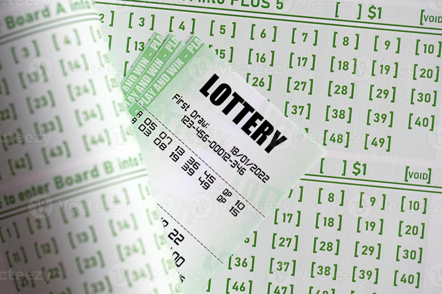 Green lottery tickets and blank bills with numbers for playing lottery photo