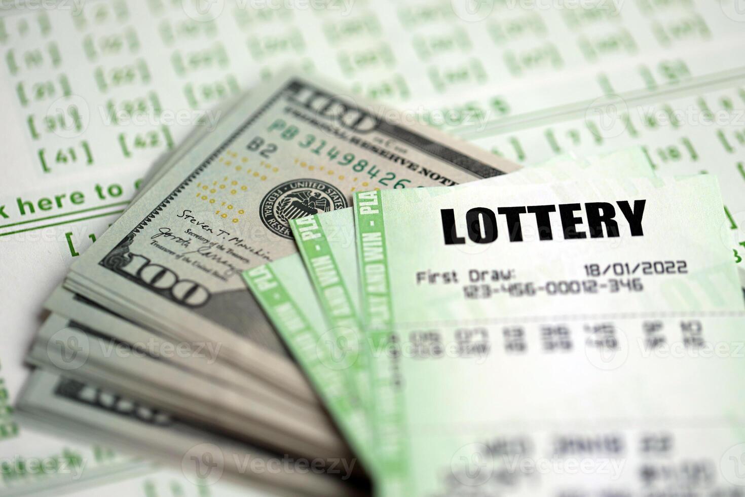 Green lottery tickets and US money bills on blank with numbers for playing lottery photo
