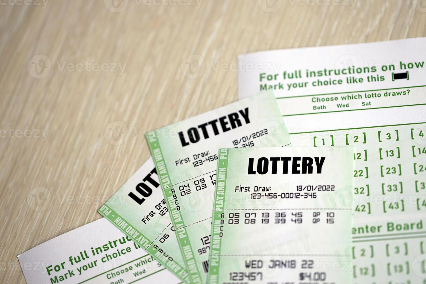 Green lottery tickets and blank bills with numbers for playing lottery photo