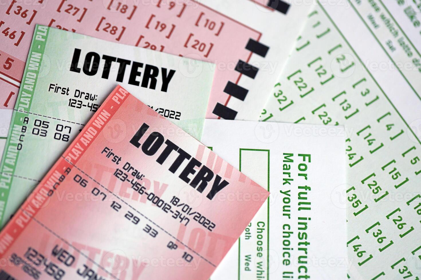 Green and red lottery tickets on blank bills with numbers for playing lottery photo