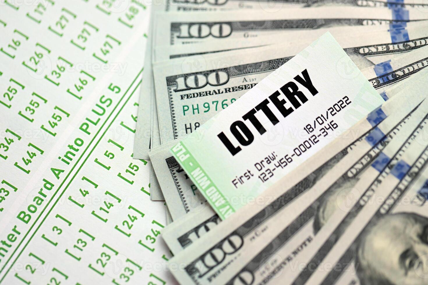 Green lottery tickets and US money bills on blank with numbers for playing lottery photo
