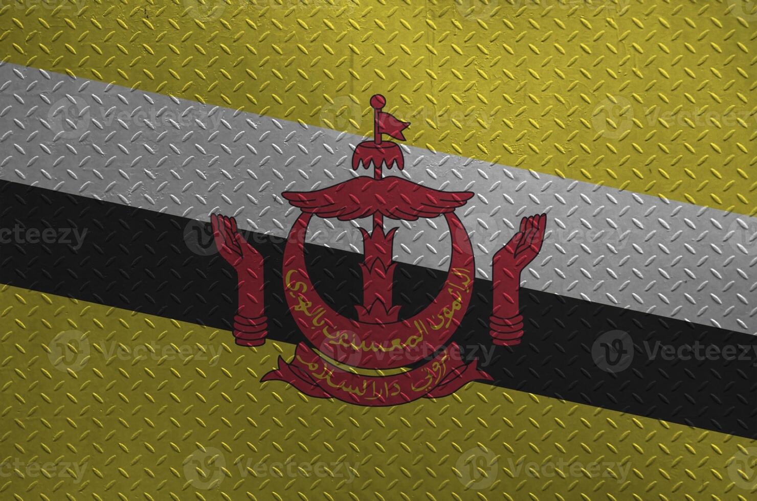 Brunei Darussalam flag depicted in paint colors on old brushed metal plate or wall closeup. Textured banner on rough background photo