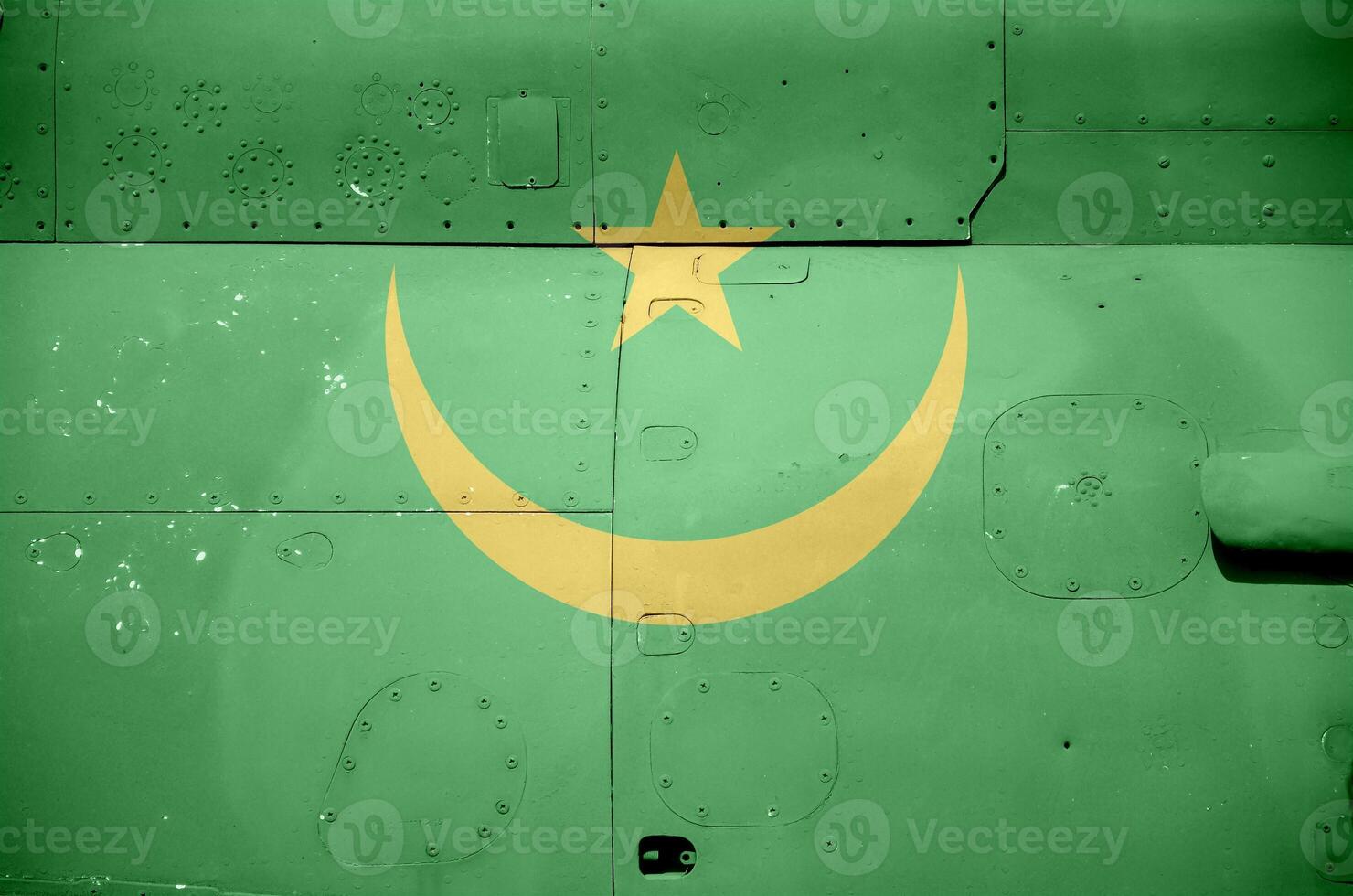Mauritania flag depicted on side part of military armored helicopter closeup. Army forces aircraft conceptual background photo