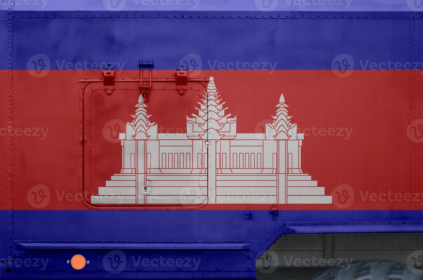 Cambodia flag depicted on side part of military armored truck closeup. Army forces conceptual background photo