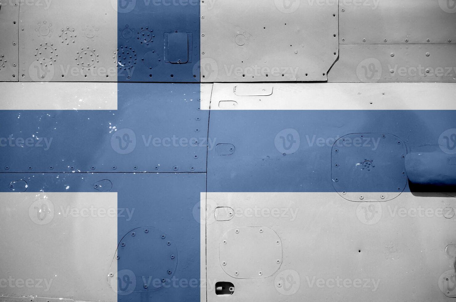 Finland flag depicted on side part of military armored helicopter closeup. Army forces aircraft conceptual background photo