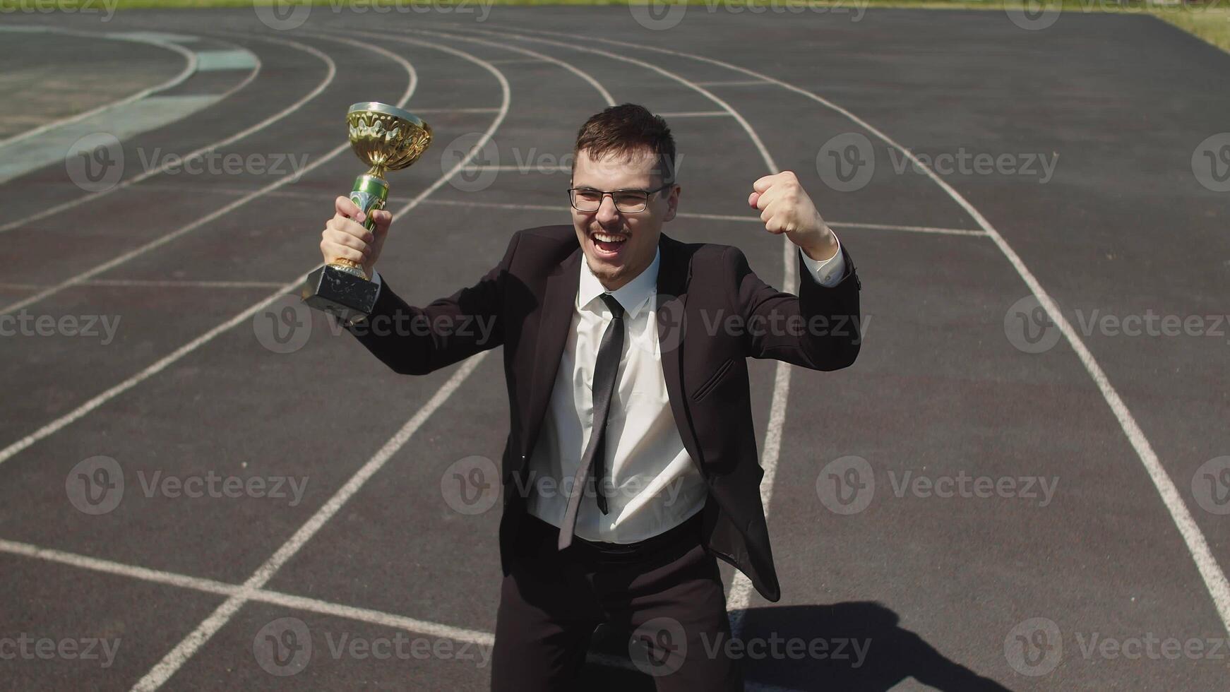Top View Of The Winning Corporate Business Man In An Office Suite With A Cup In photo