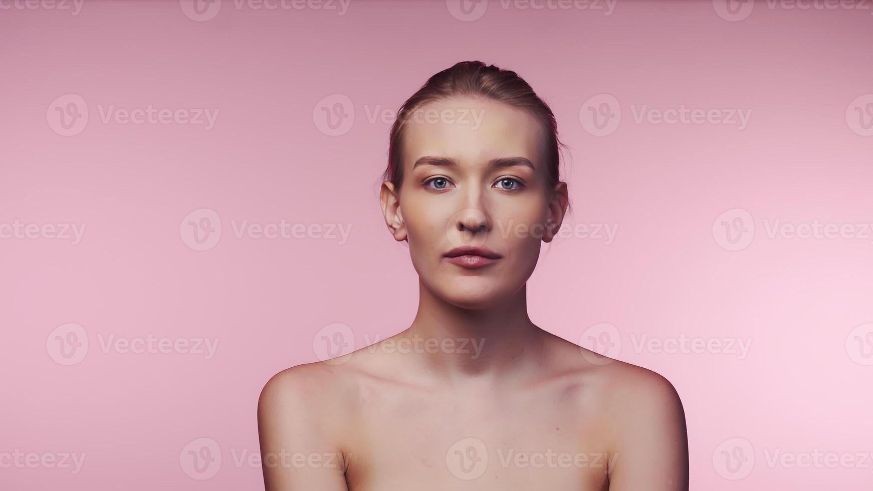 Young Beautiful Caucasian Woman With Spectacular Makeup Slowly Touching Her Own photo