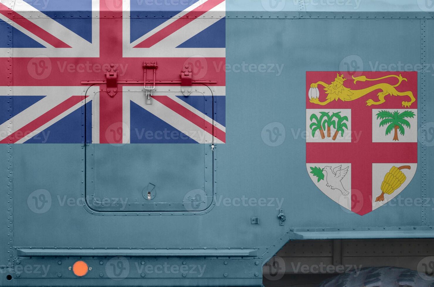 Fiji flag depicted on side part of military armored truck closeup. Army forces conceptual background photo