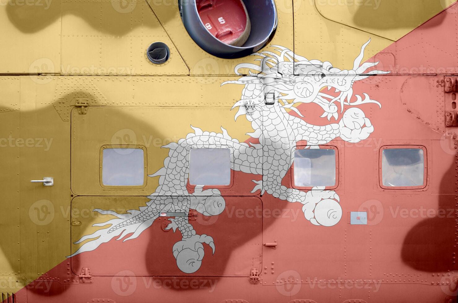 Bhutan flag depicted on side part of military armored helicopter closeup. Army forces aircraft conceptual background photo