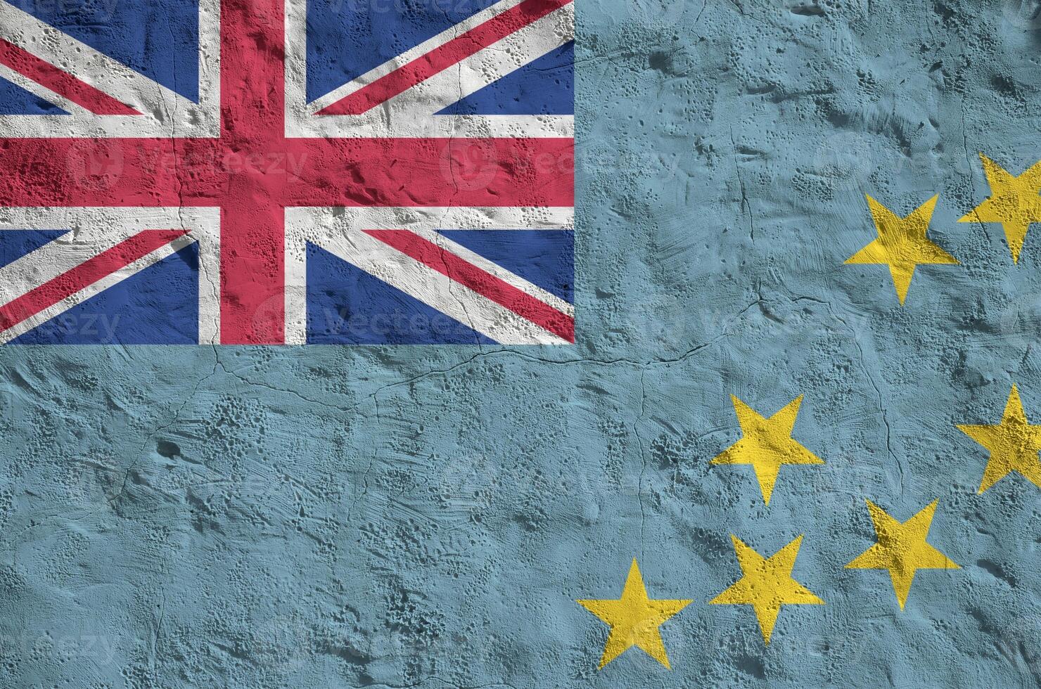 Tuvalu flag depicted in bright paint colors on old relief plastering wall. Textured banner on rough background photo