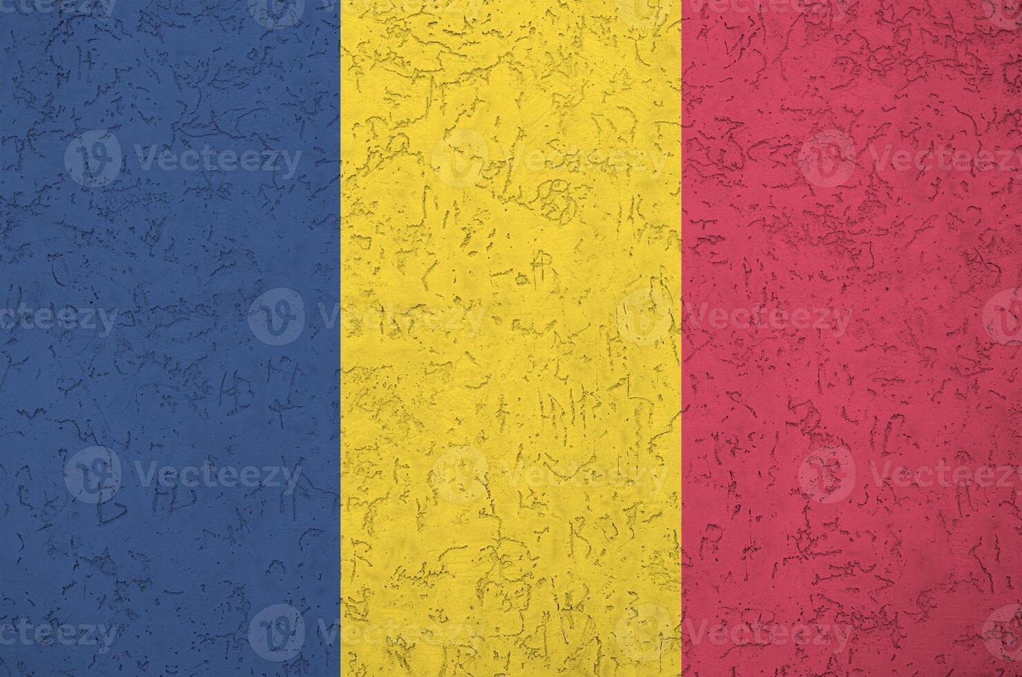 Chad flag depicted in bright paint colors on old relief plastering wall. Textured banner on rough background photo