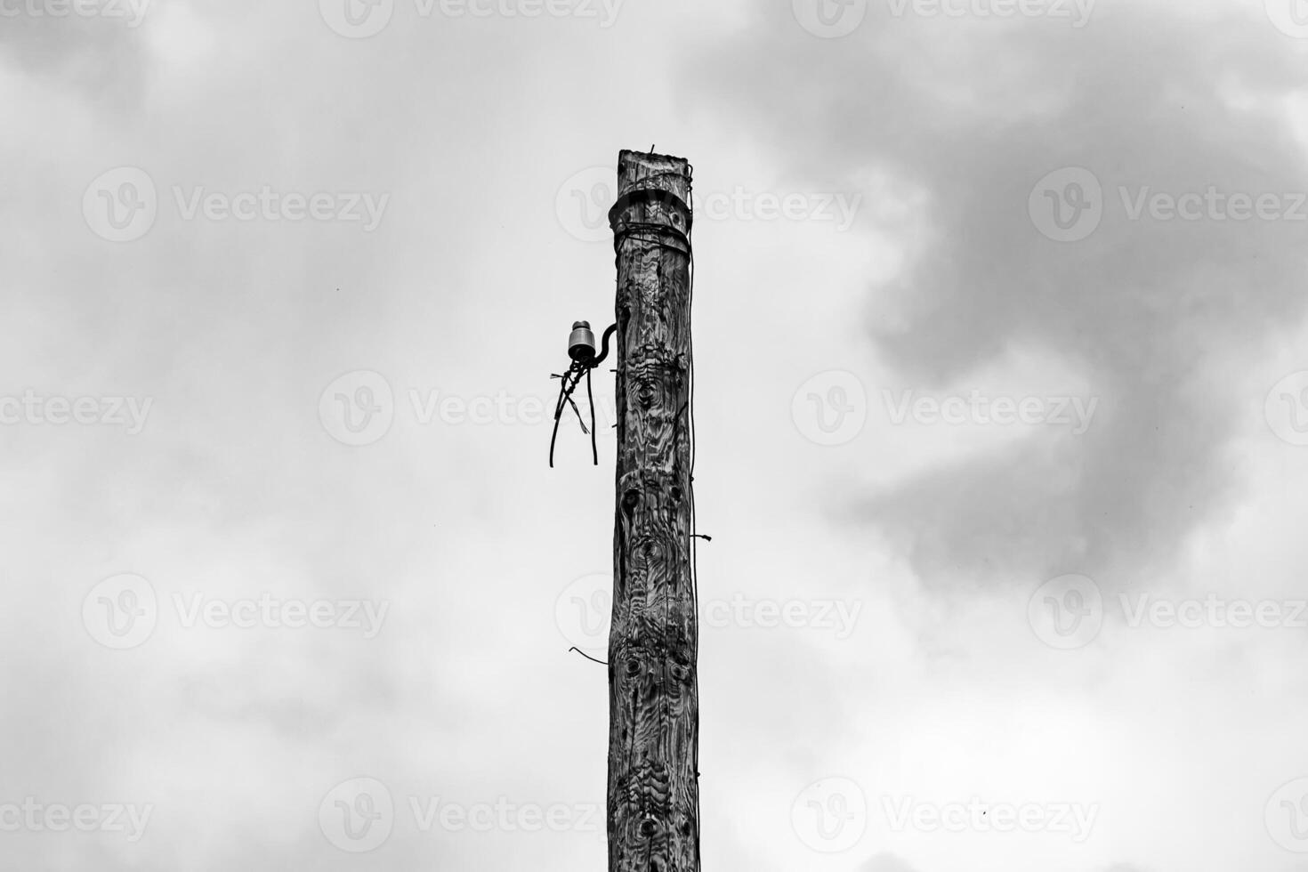 Power electric pole with line wire on dark background close up photo