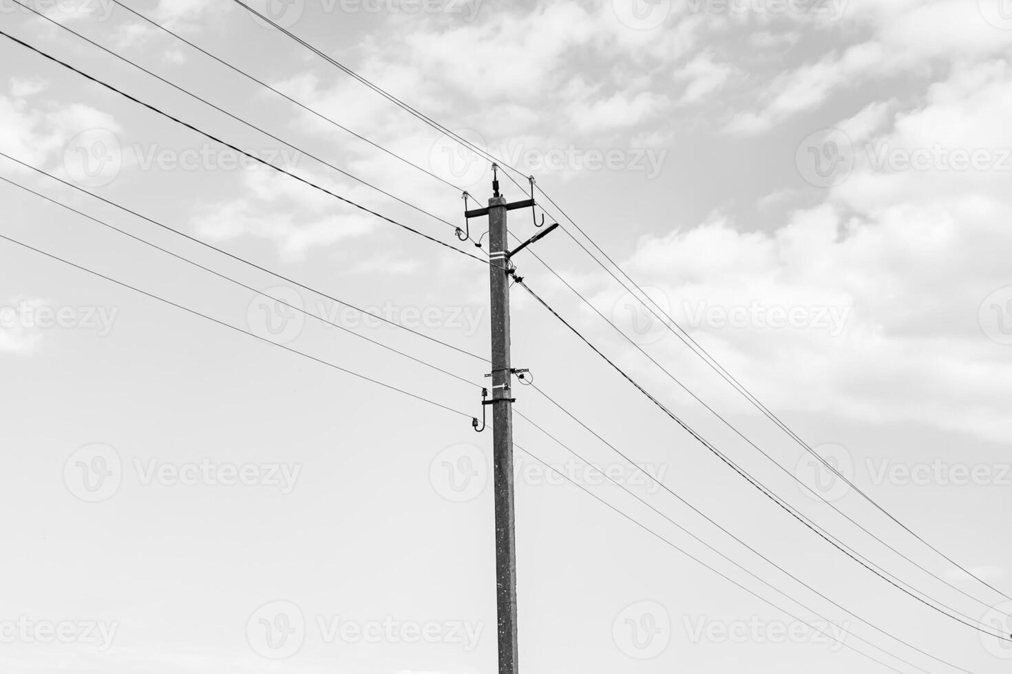 Power electric pole with line wire on dark background close up photo