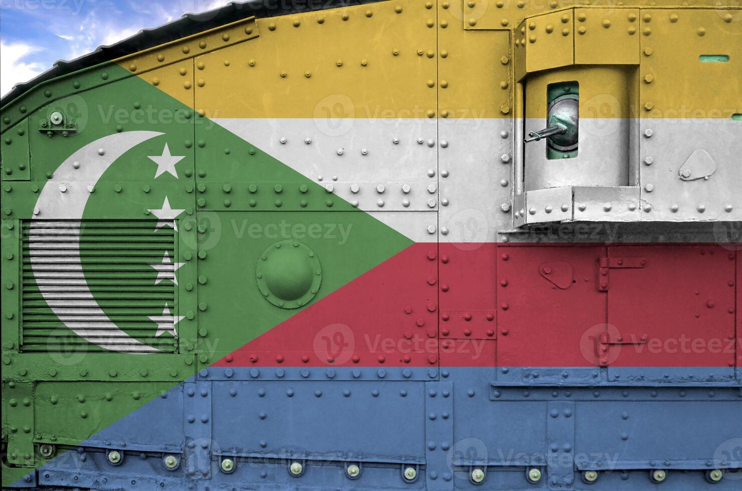 Comoros flag depicted on side part of military armored tank closeup. Army forces conceptual background photo