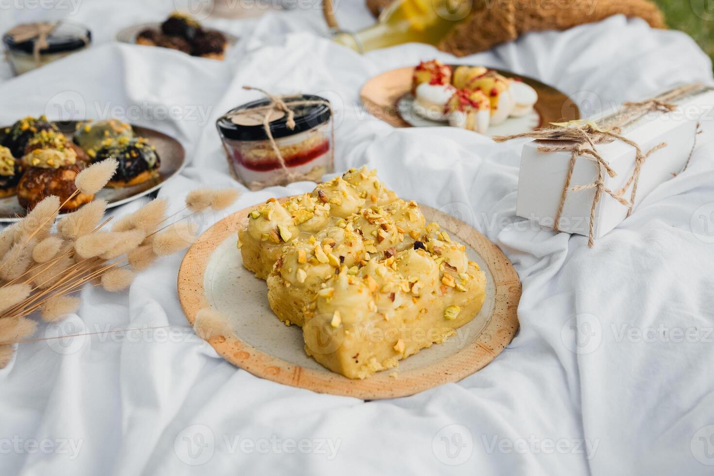 Delightful Spread. Picnic Table With Mouthwatering Food and Desserts photo